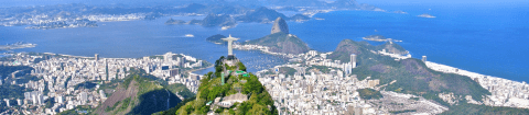 Aerial shot of Christ the Redeemer with Sugarloaf Mountain in the distance in Rio de Janeiro on a luxury Brazil tour