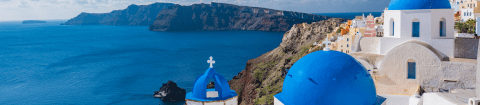 Blue domed houses in Greece during luxury tour