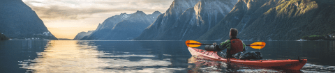 Private kayaking excursion in Hjørundfjord Fjord during luxury summer tour in Norway