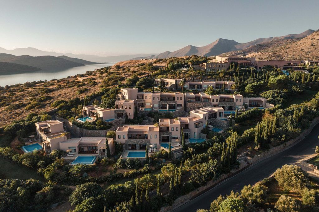 An aerial shot of the exterior of Phaea Blue Palace in Crete.
