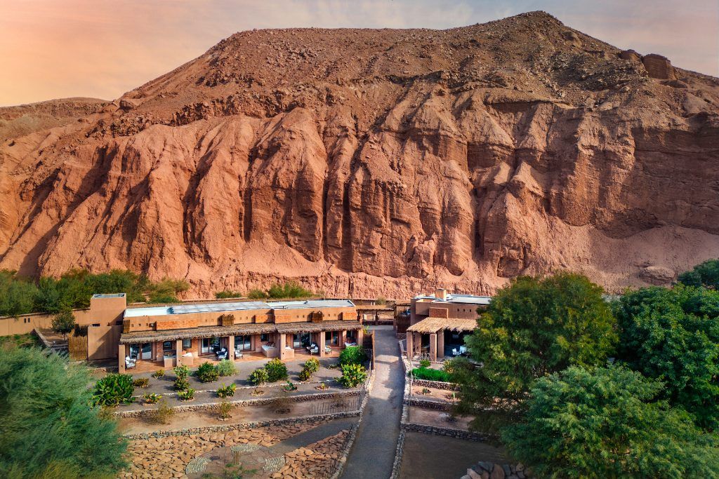 An aerial view of Nayara Alto Atacama against a rocky backdrop.