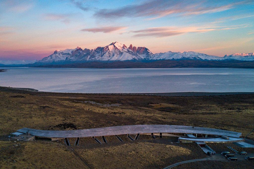 A sunset view of Tierra Patagonia with the mountains in the background.