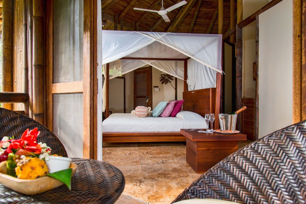 View of one of the beds with a canopy around it in La Selva Amazon Ecolodge & Spa.