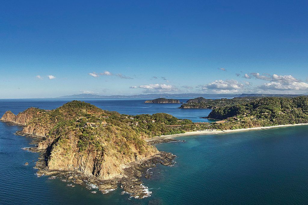 An aerial view of the Papagayo Peninsula showing the Four Seasons resort on the waterfront.