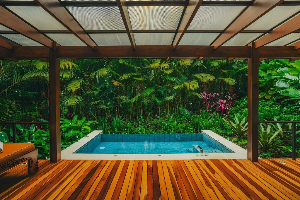 An infinity pool at Nayara Springs resort with the jungle in the background.