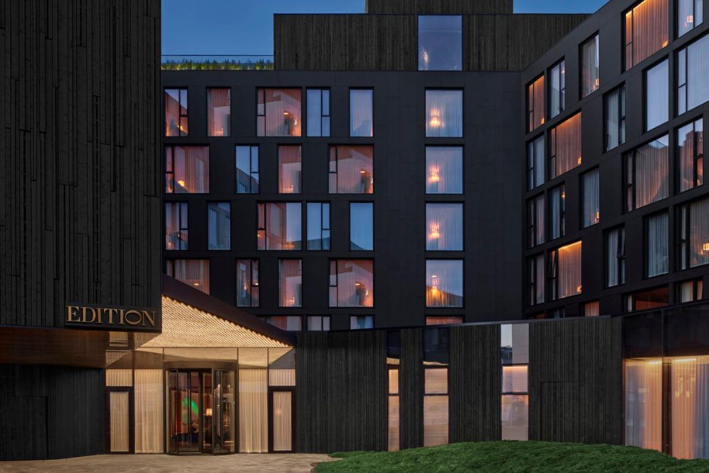 The exterior of the Reykjavik EDITION in dim winter lighting.