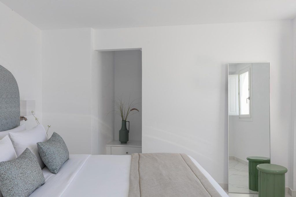 One of the simple white rooms at Canavas Oia Suites.