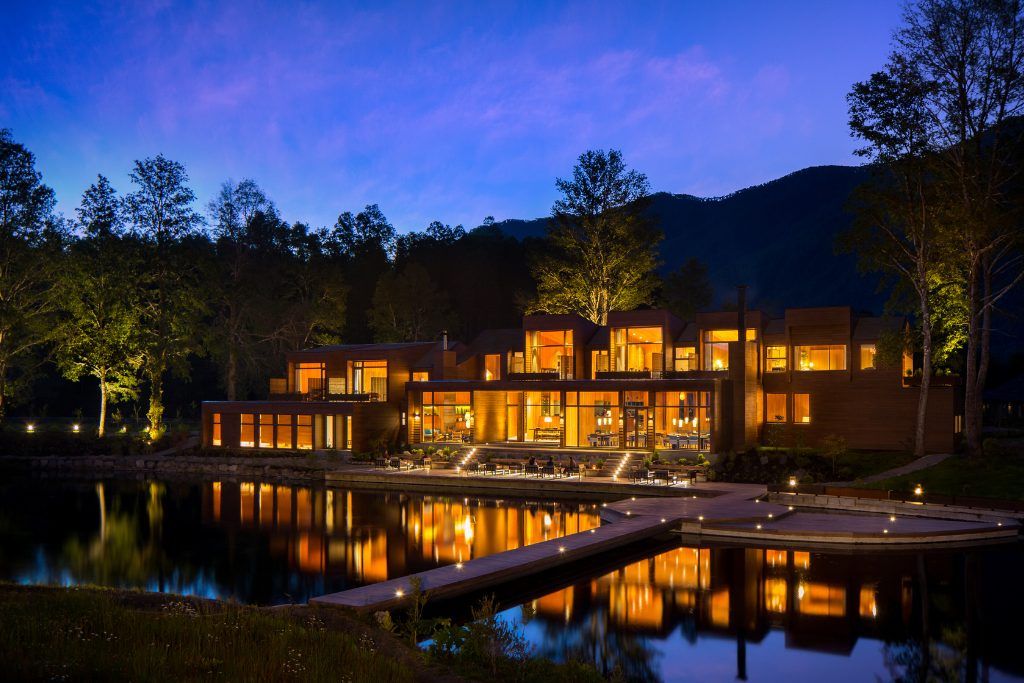 A nighttime view of the exterior of the Vira Vira lodge.