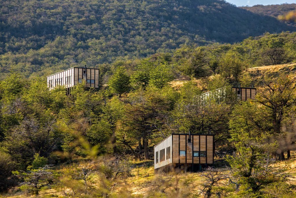 An exterior view of Awasi Patagonia nestled in the hills.