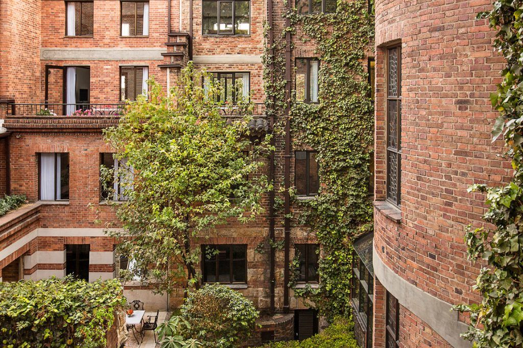 The exterior of the Four Seasons Casa Medina in Bogota with ivy on the brick walls.
