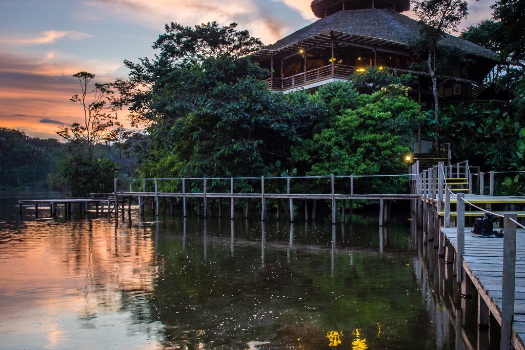 Riverfront view of La Selva Ecolodge in the Amazon Rainforest.