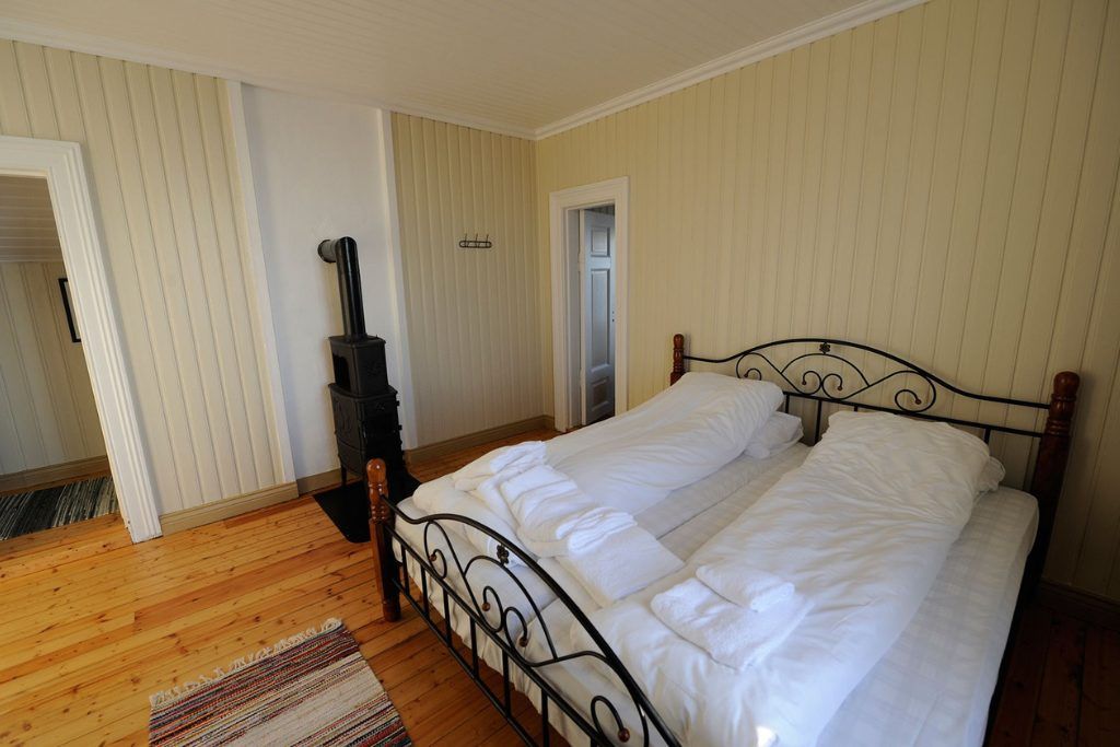 One of the main bedrooms in the private lighthouse with a wood heating system.