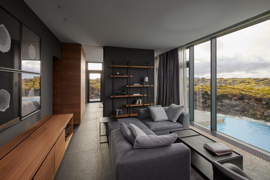 A living space with a view of the Blue Lagoon at the Retreat hotel.