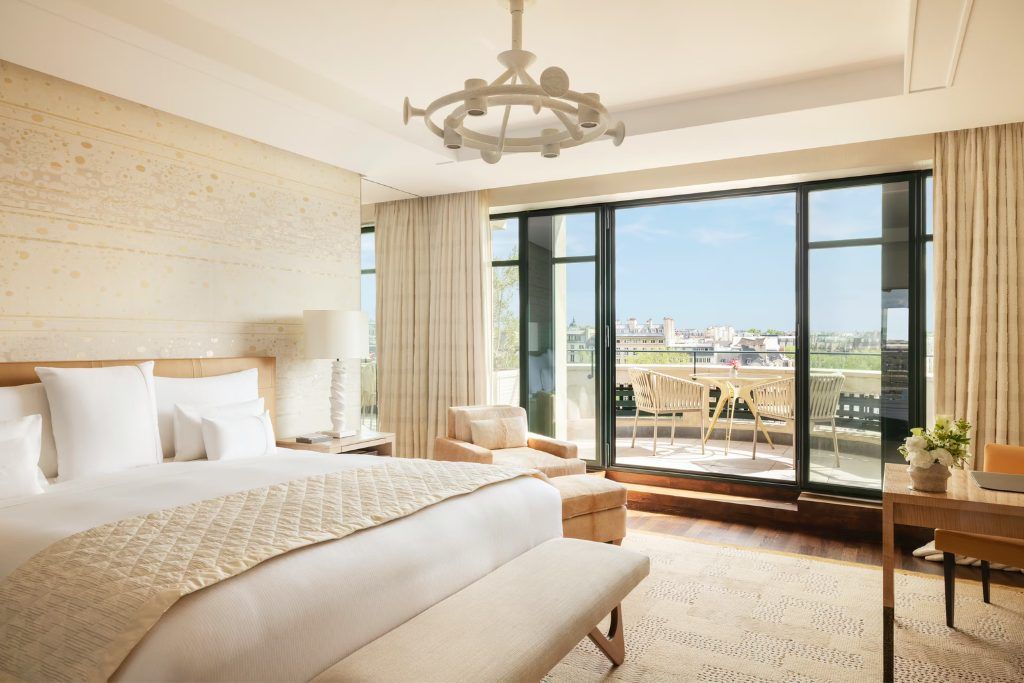 One of the modern rooms with a large window overlooking Paris at the Cheval Blanc.