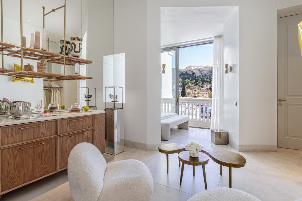 A view of one of the bedrooms and the lounge area at The Dolli Hotel.