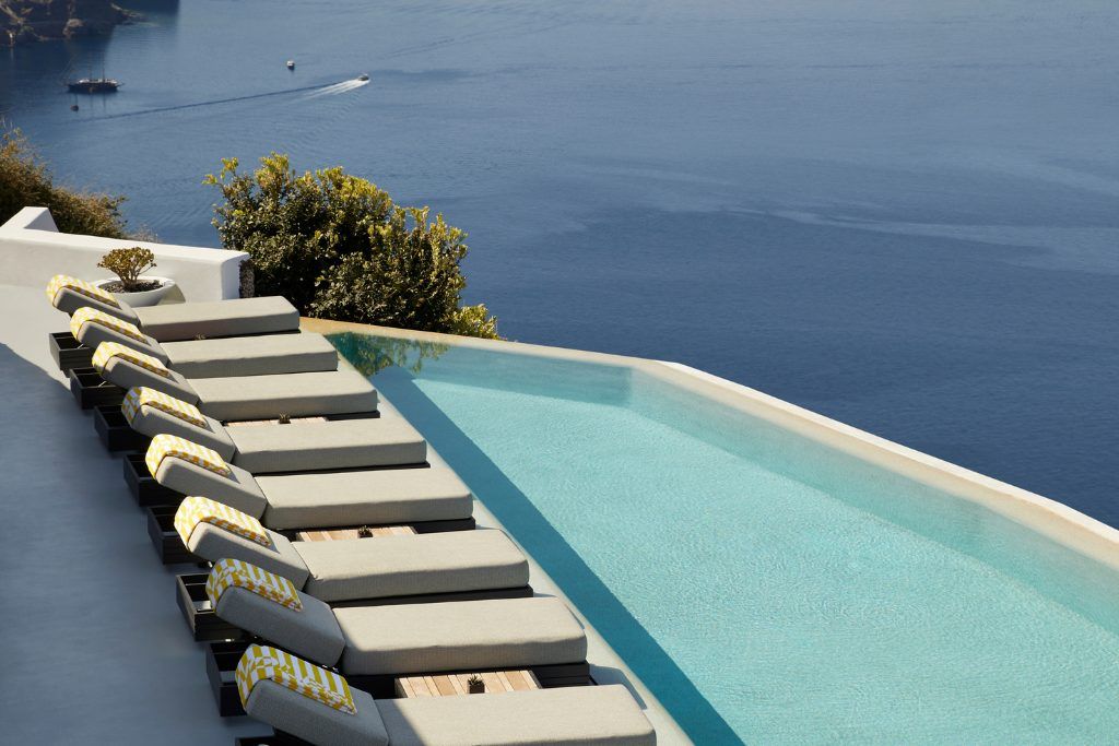 The infinity pool at The Grace overlooking the water in Santorini.