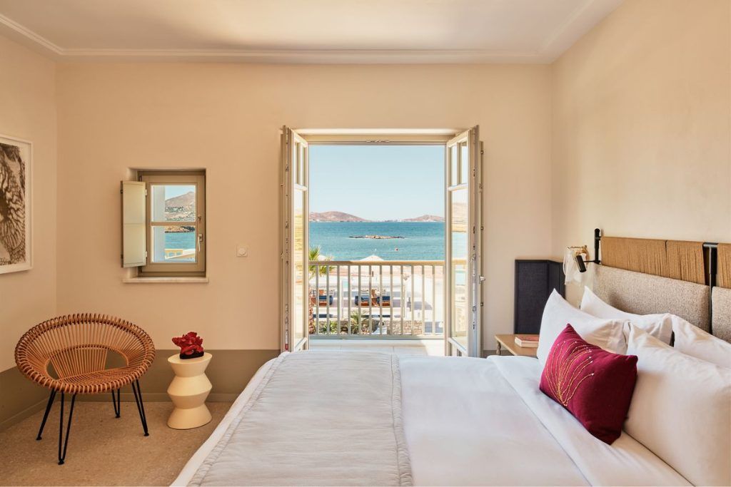 One of the bedrooms with a balcony overlooking the sea at Cosme in Paros.