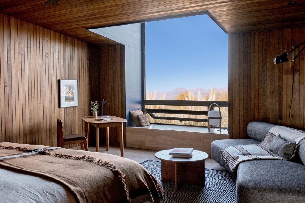 The interior of one of the rooms at Tierra Atacama with a bed and sofa.