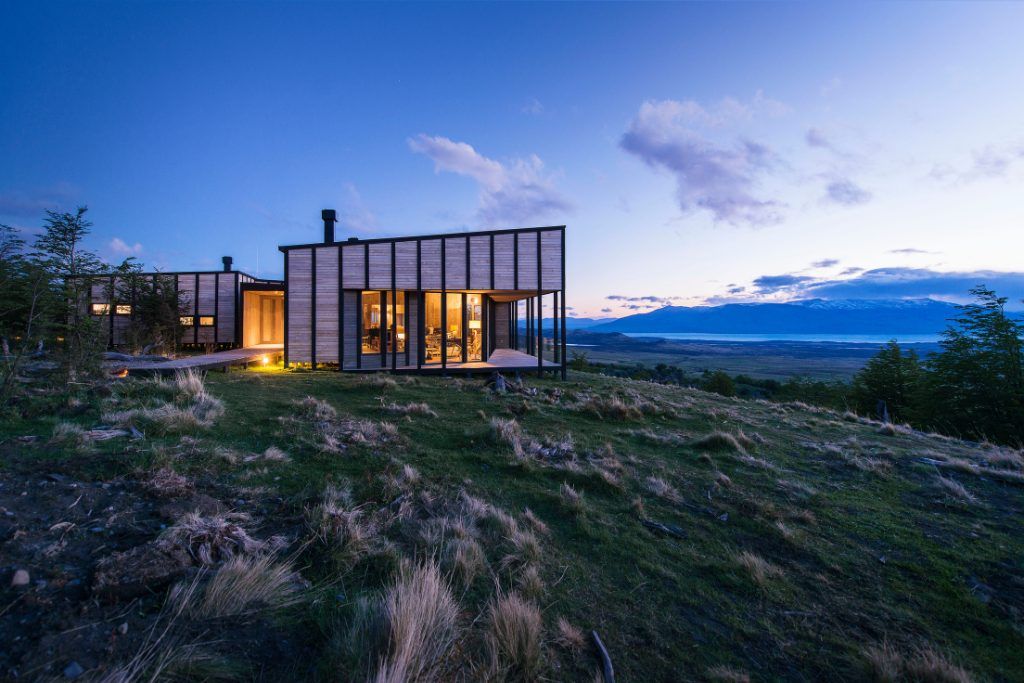 A view of the exterior of Awasi Patagonia at sundown.