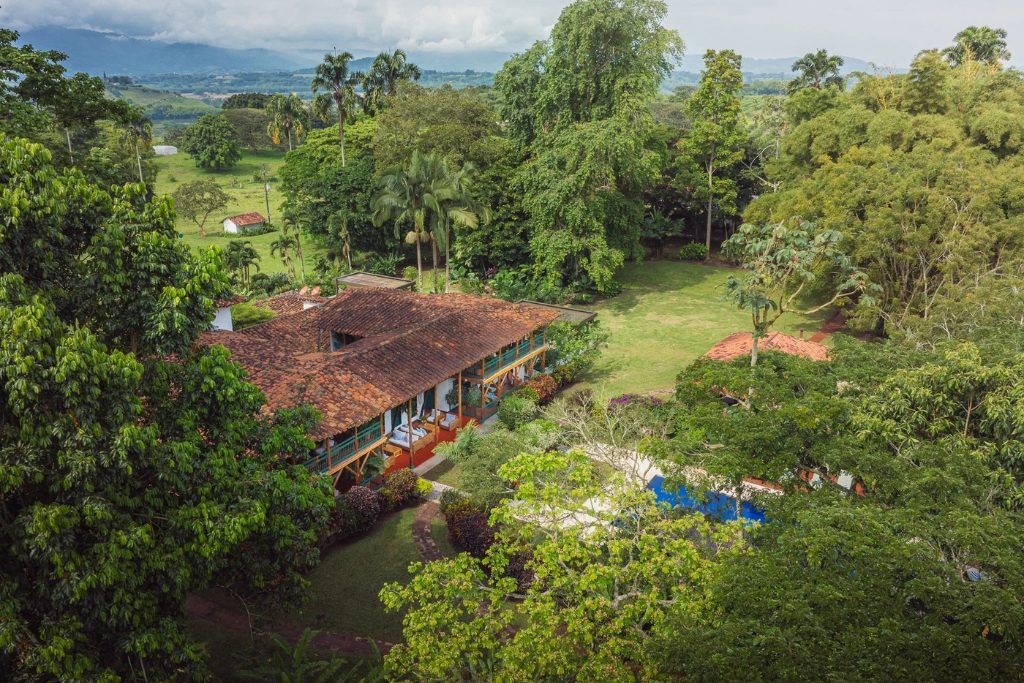 An aerial view of Hacienda Bambusa and the surrounding hills in the coffee region.