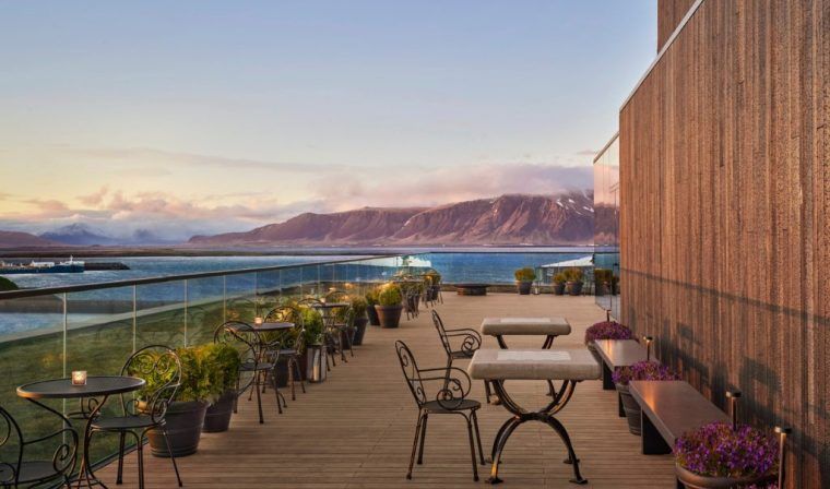 The patio at the Reykjavik EDITION with Mount Esja in the background.