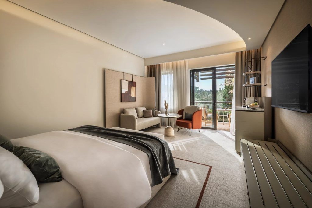 A view of one of the bedrooms with a patio and lounge area at the Monte Mullini.