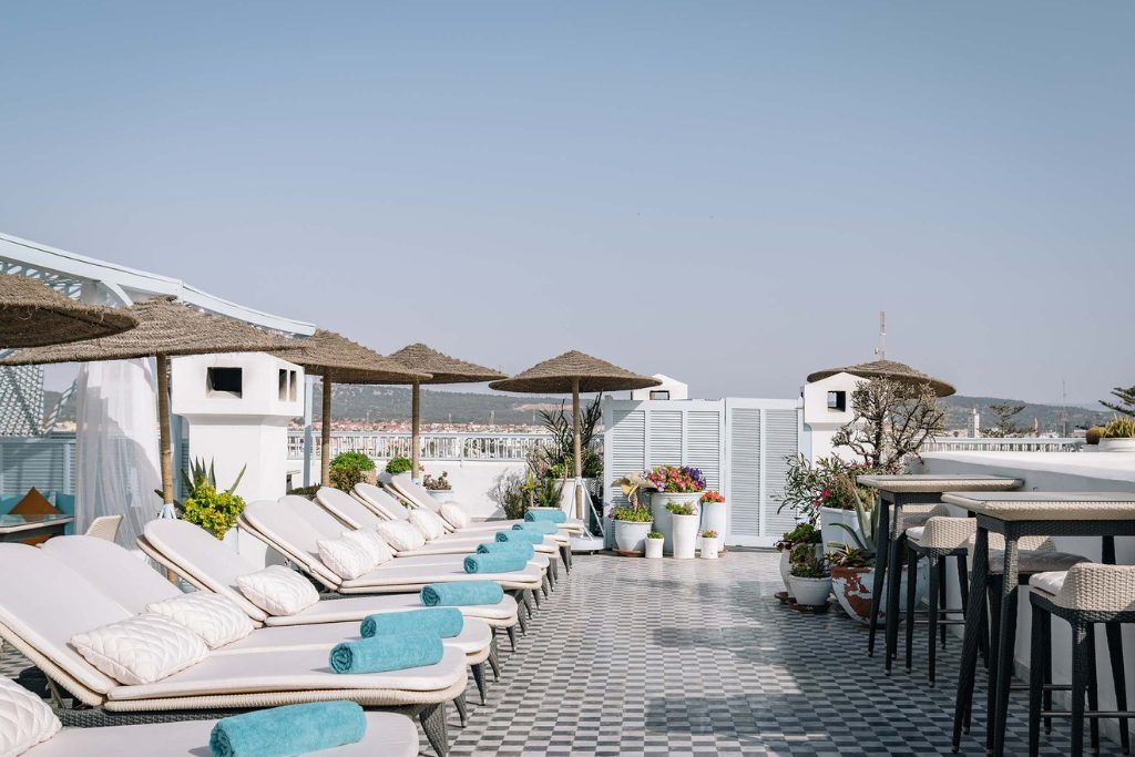 The rooftop with loungers in the sun at Heure Bleu Palais.