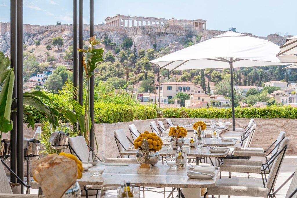 The outdoor restaurant with the Acropolis in the background at The Dolli Hotel.