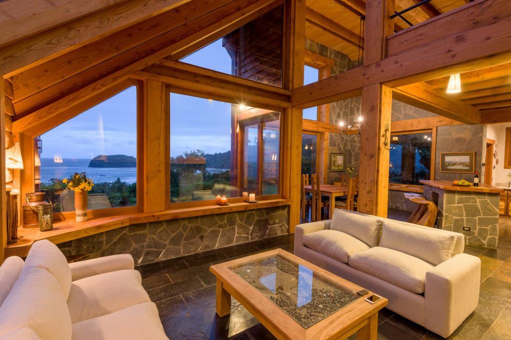 The lounge with a large window looking at the ocean at Mari Mari.