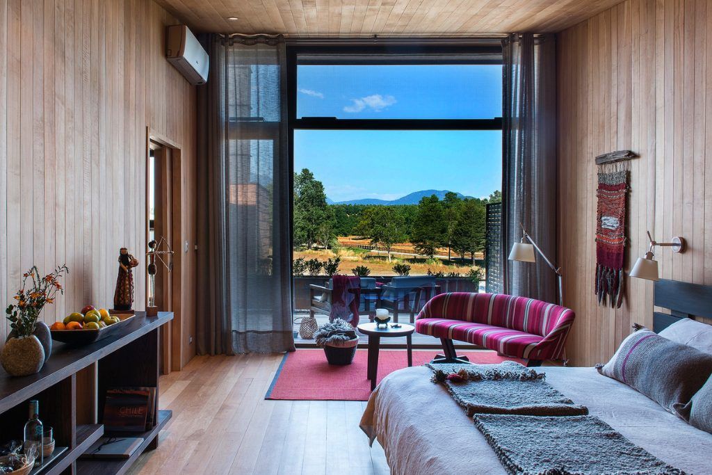 A view of one of the bedrooms at the Vira Vira lodge with a large window.