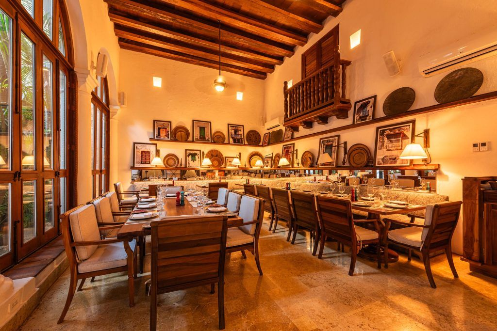 The dining room with two long tables at Casa San Augustin.