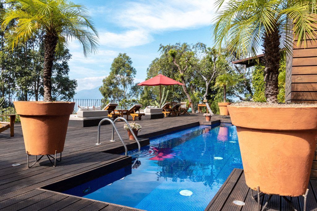 The outdoor pool with loungers at Casa Palopo.