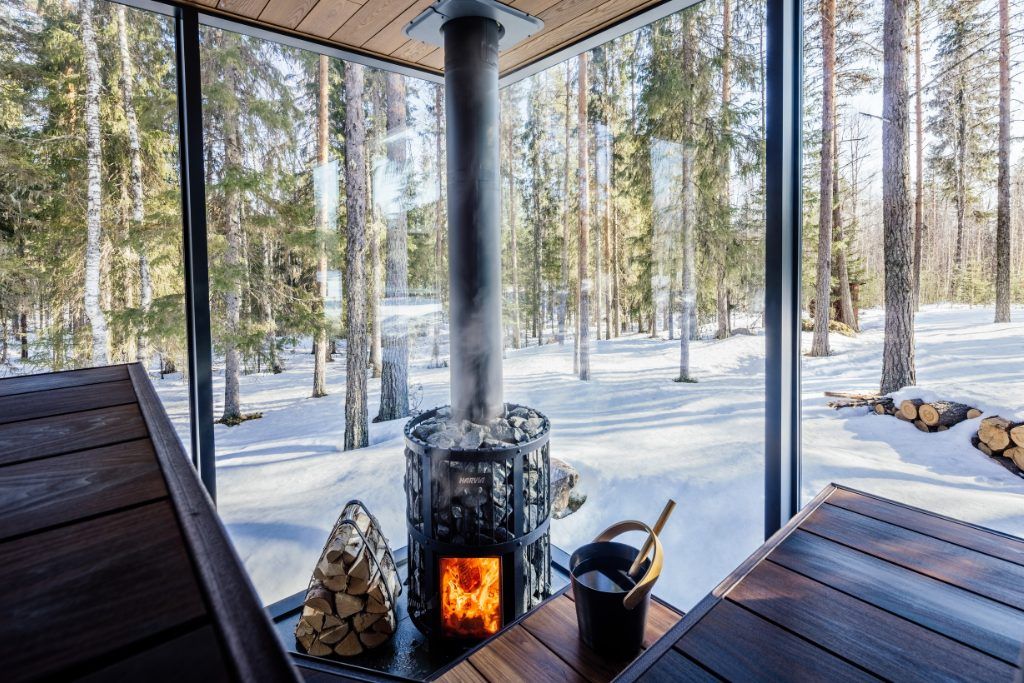 A sauna with a panoramic view and fire in Swedish Lapland.
