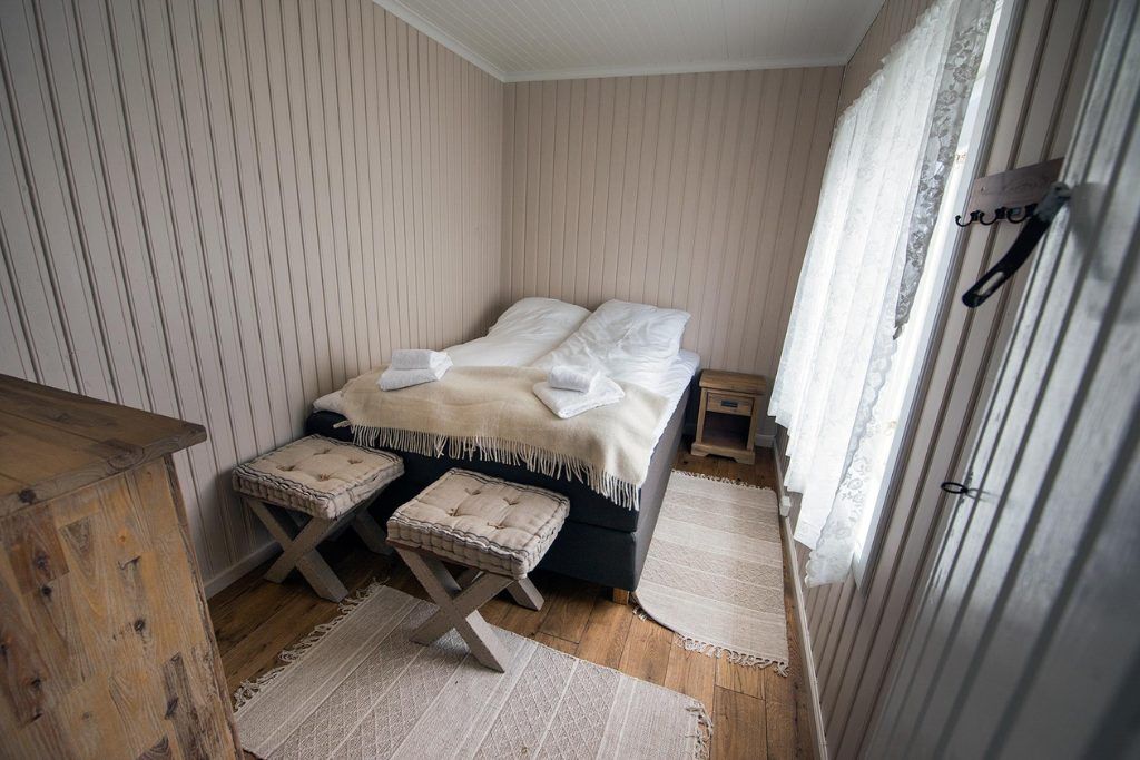 One of the secondary bedrooms in a private lighthouse with a sunny window.