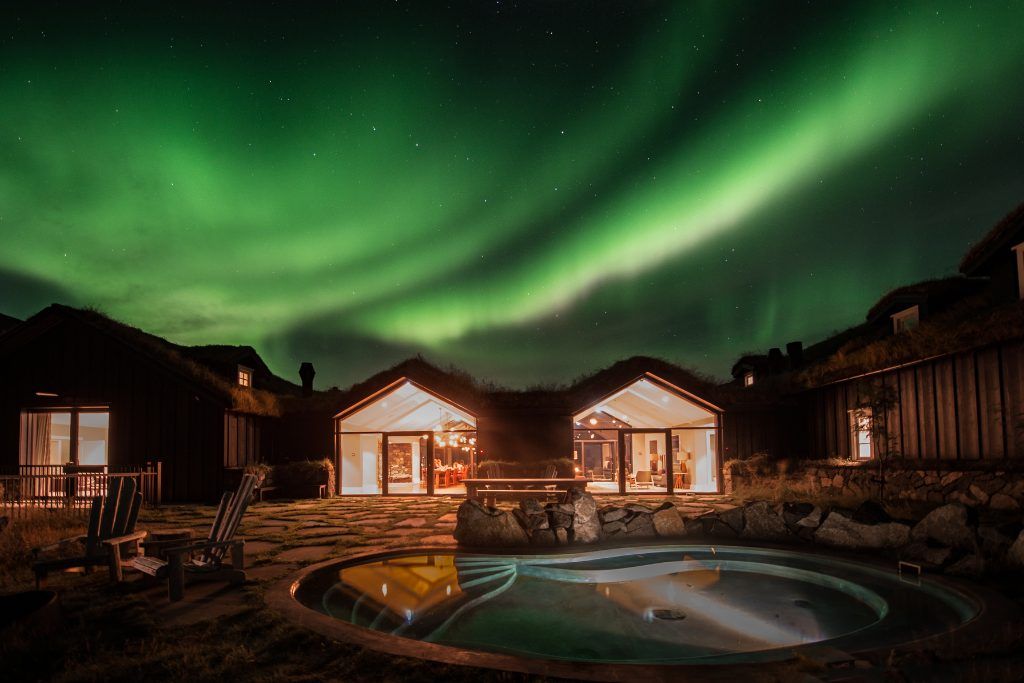 The swimming pool at Deplar Farm with the Northern Lights overhead.