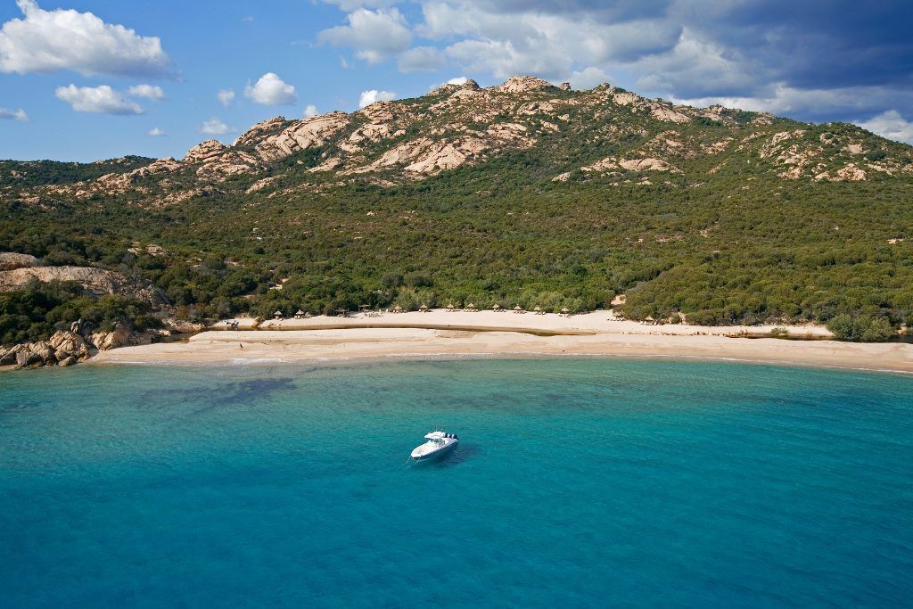 The bay with a yacht in it at Domaine de Murtoli.