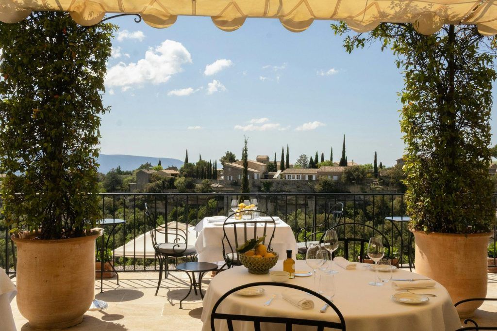 The garden terrace at La Bastide overlooking greenery in the valley of Provence.