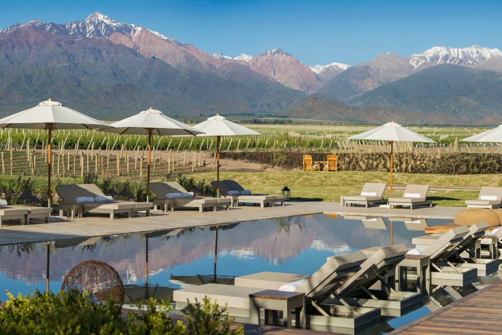 The swimming pool with the mountains in the background at The Vines Resort & Spa in Mendoza.