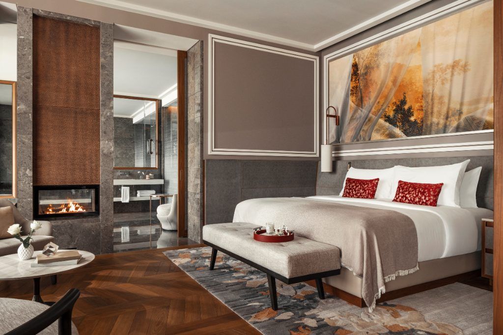 A bedroom with a painting on the wall at the One&Only Portonovi.