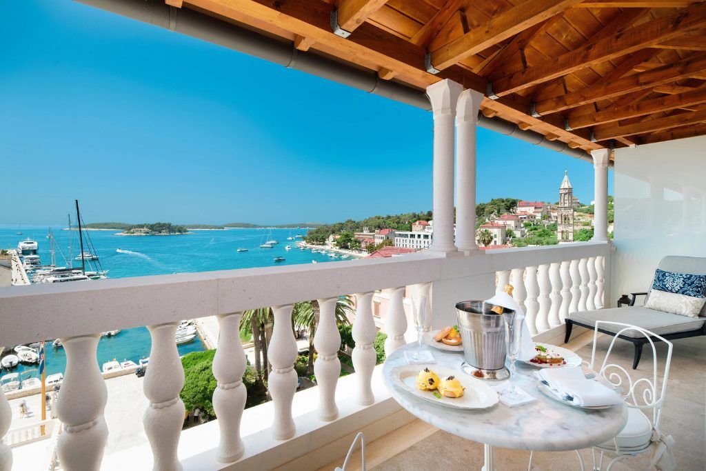 A balcony with breakfast on the table at Palace Elisabeth on Hvar.