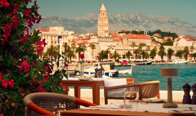 The patio at the Ambassador Hotel overlooking the town of split.