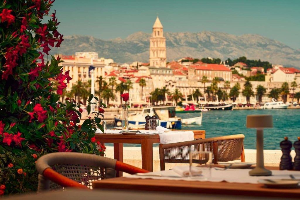 The patio at the Ambassador Hotel overlooking the town of split.