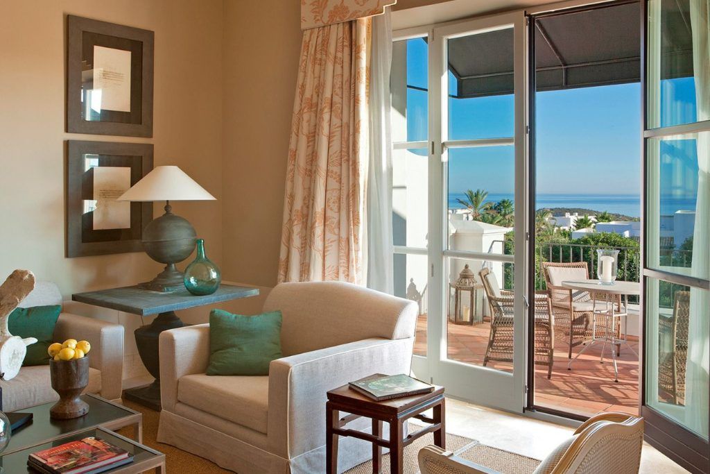 A bedroom lounge area in Finca Hotel Cortesin.