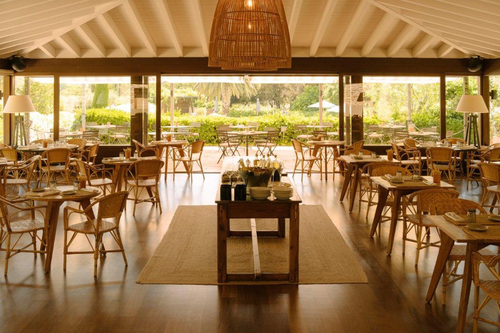A restaurant looking out into the garden at Mas de Torrent.