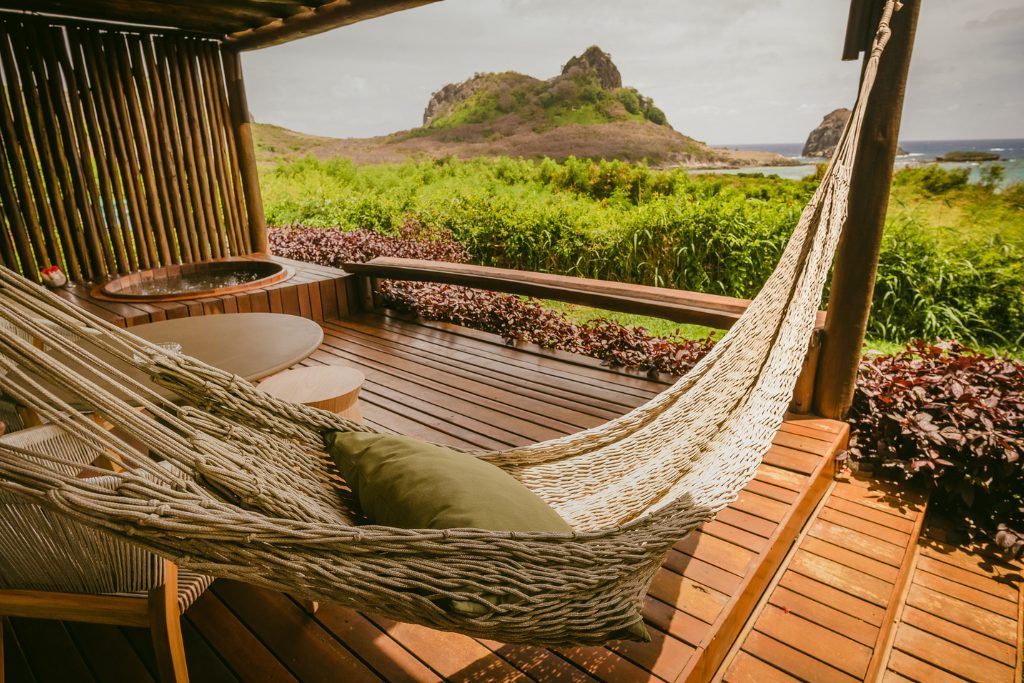 A hammock hanging on the porch of one of Pousada Maravilha's bungalows.
