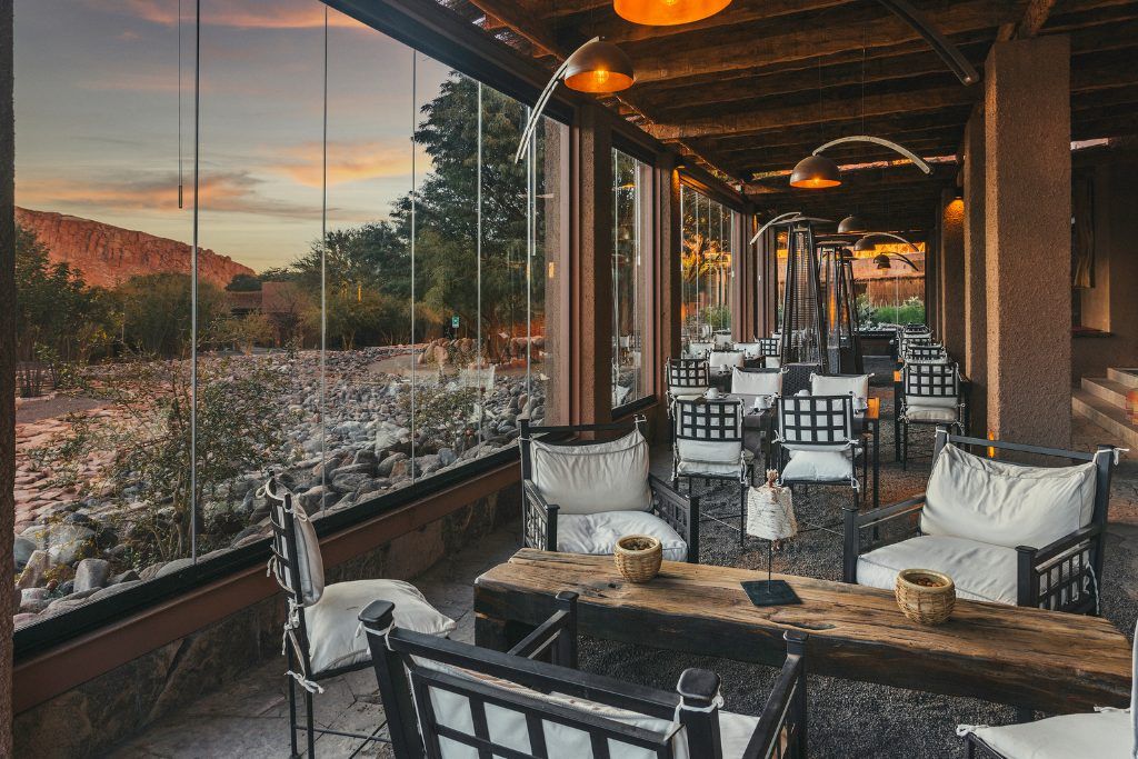 A table next to a large window at the restaurant in Nayara Alto Atacama.