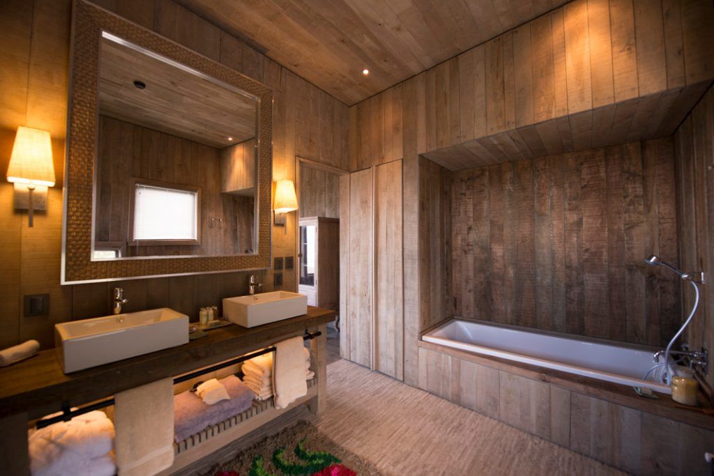 The bathroom in one of the wood-paneled rooms at Awasi Patagonia.
