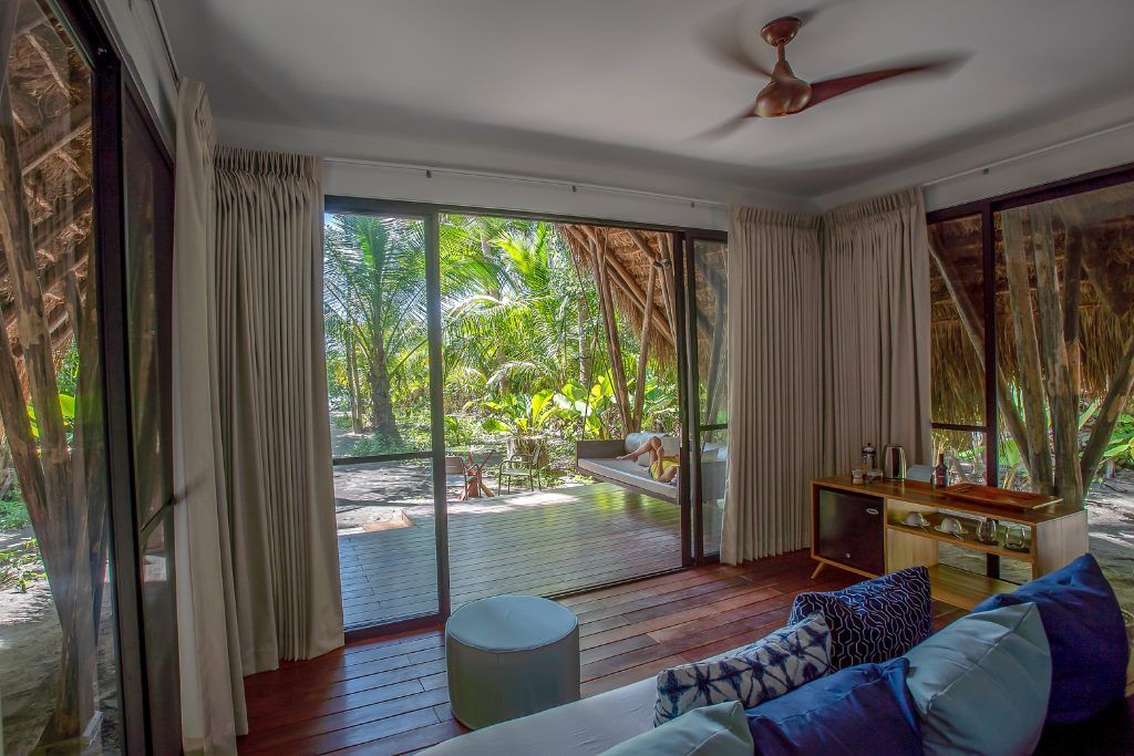 A view of the porch and living area attached to one of the bungalows on Isla Palenque.
