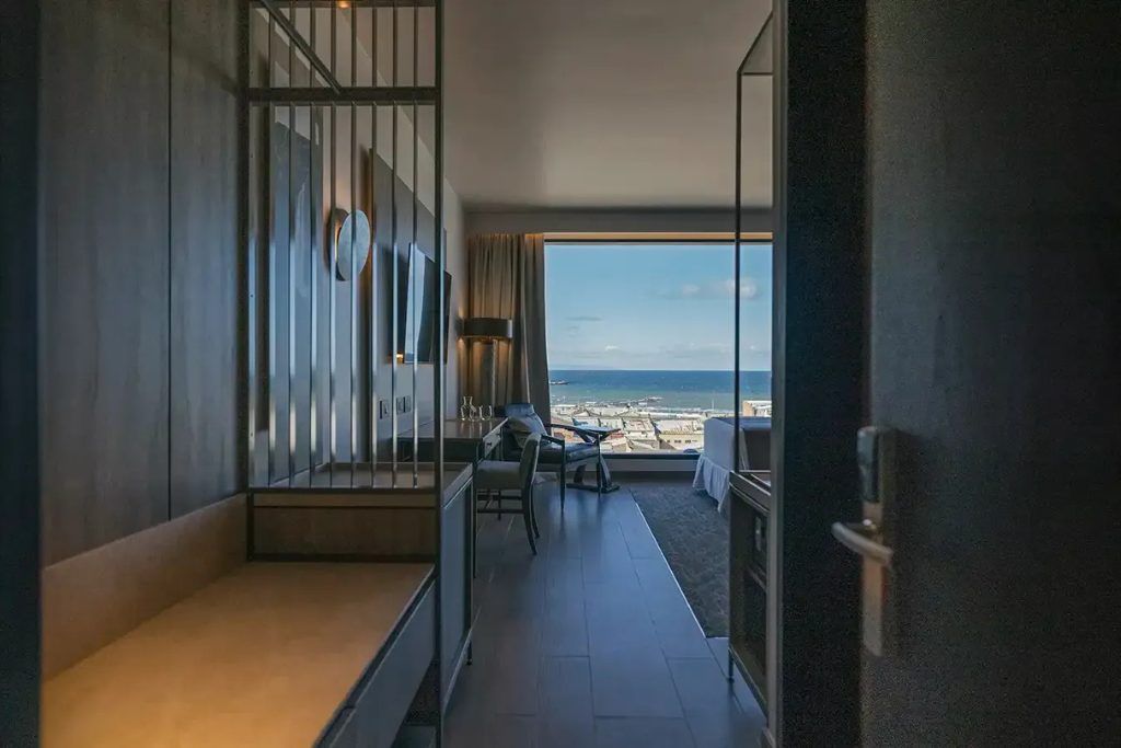 A view of one of the bedrooms in the Cabo de Hornos hotel with a view over the bay.