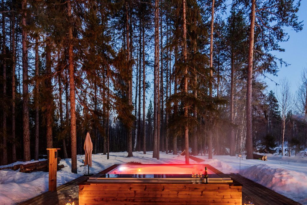 A night view of the jacuzzi at Logger's Lodge in Swedish Lapland.